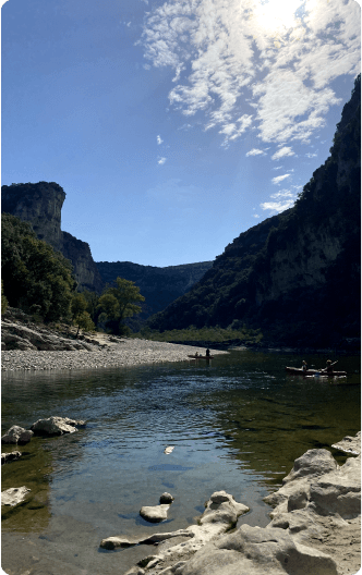 Ardèche river bank with limestone cliffs